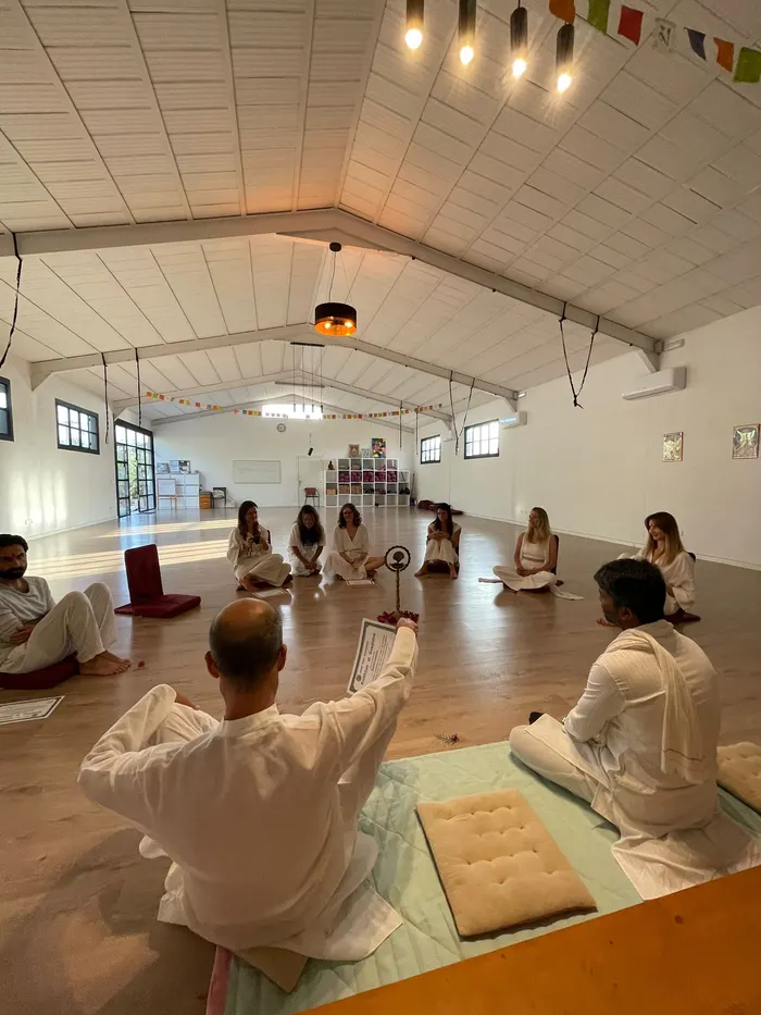 Yoga teacher training closing ceremony, group seated in a circle