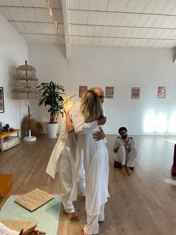 A warm embrace after a yoga teacher training session